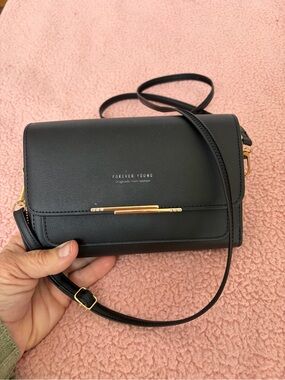 Forever young crossbody black bag with gold trim